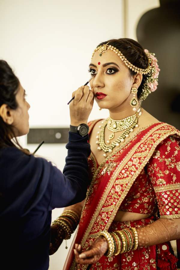 Bride doing makeup